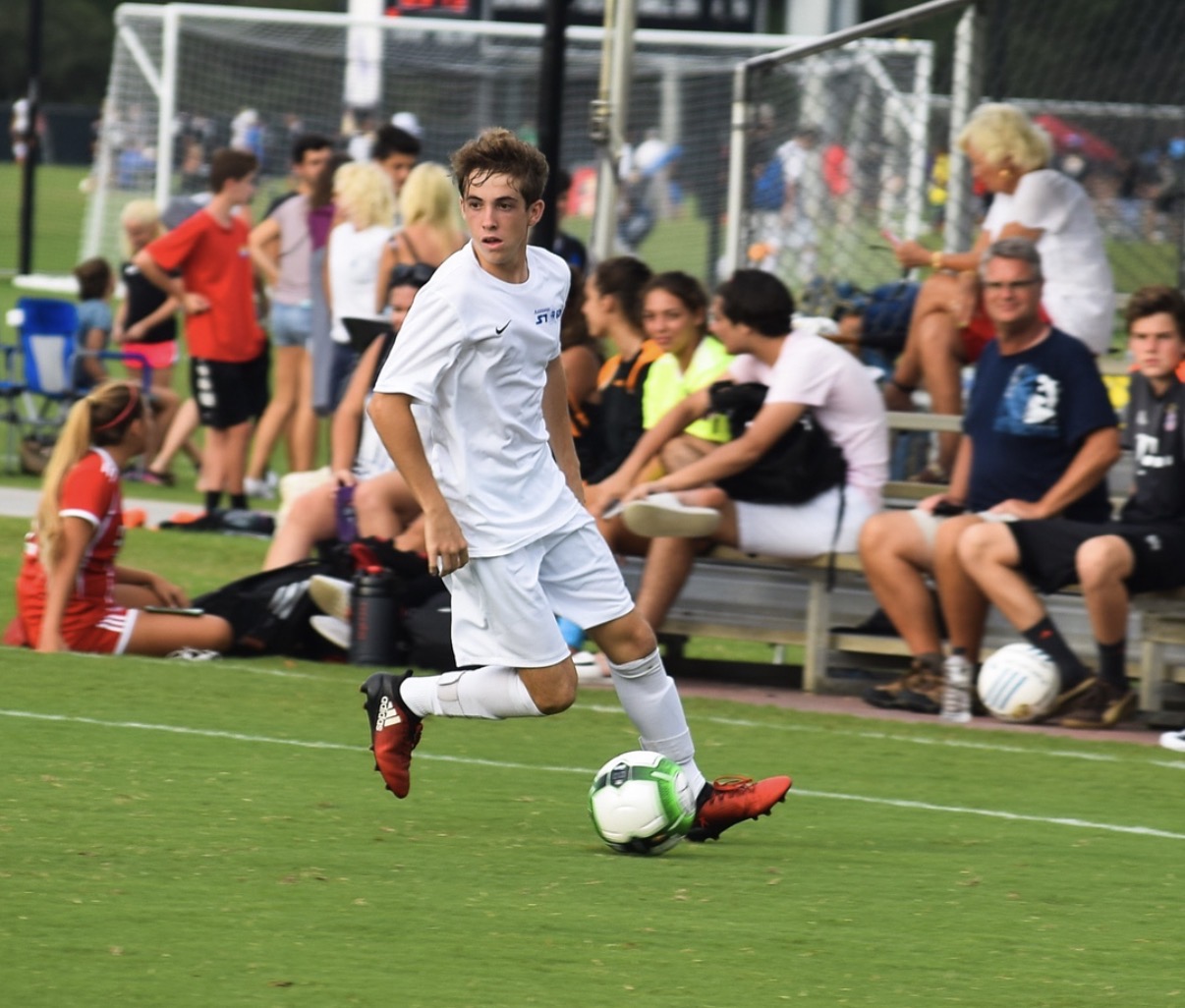 A player dribbling upfield