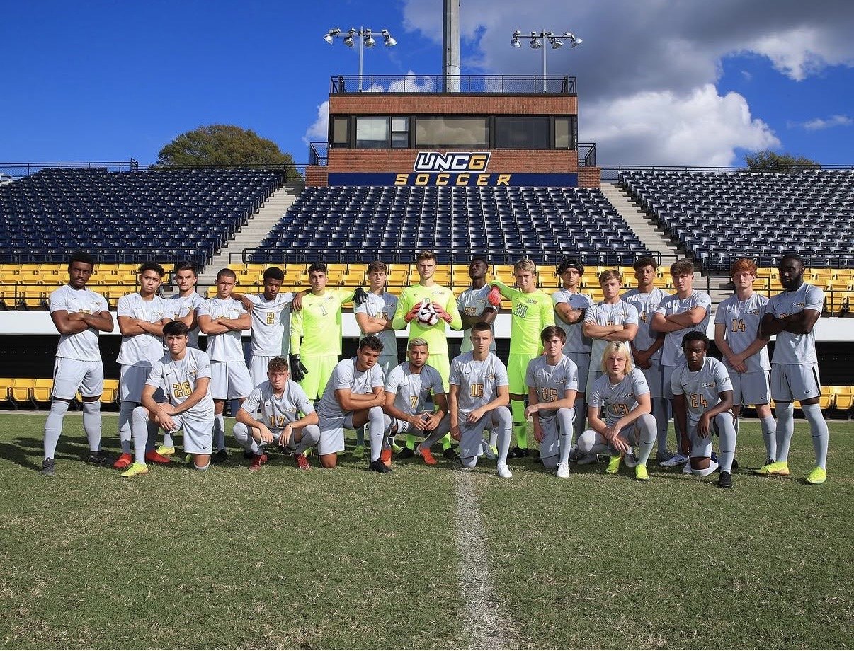 A college team lined up on the pitch